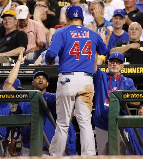 Rizzo center singles off Pittsburgh Pirates relief pitcher Joe Blanton driving in teammate Addison Russell left from third during the third inning of a baseball game in Pittsburgh Monday Aug. 3 2015. (AP