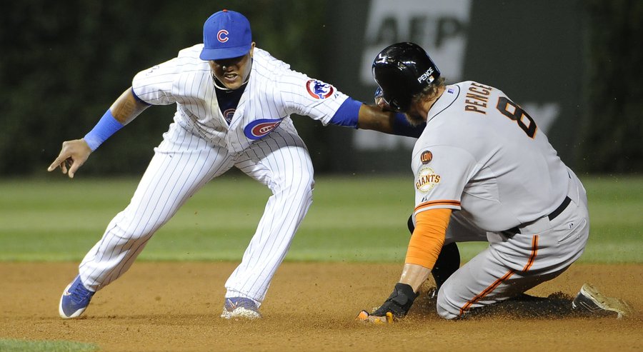 San Francisco Giants&#39 Hunter Pence steals second base as Chicago Cubs shortstop Starlin Castro left makes a late tag during the sixth inning of a baseball game Thursday Aug. 6 2015 in Chicago