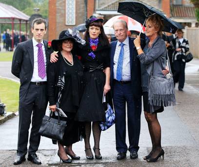 From left George Cole’s son Toby wife Penny and daughter Tara and Dennis Waterman with wife Pam at Reading Crematorium following the funeral of the actor