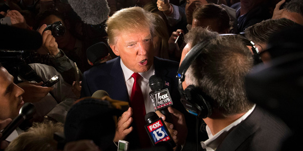 Republican presidential candidate Donald Trump speaks to the media in the spin room after the first Republican presidential debate in Cleveland