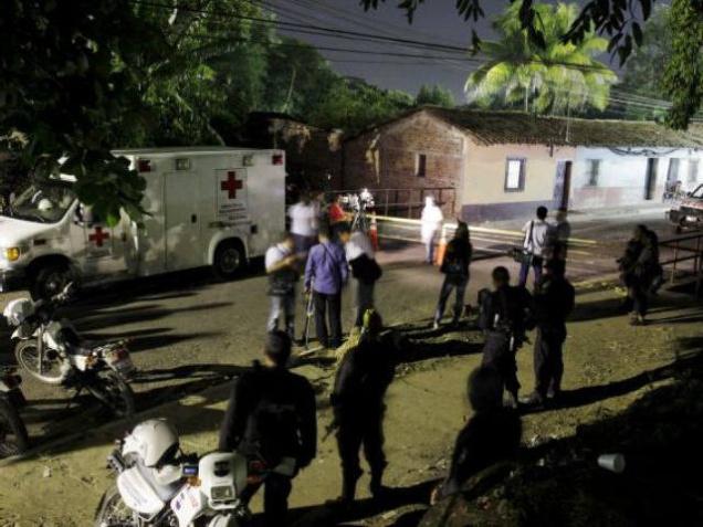 A patrol car custodies a surrounding area of a prison where 14 members of the Barrio 18 group were killed at Quetzaltepeque in El Salvador on The 14 belonged to one of El Salvador's most powerful street gangs and were killed in a prison on Satur