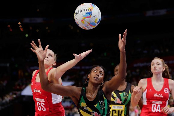 England’s Joanne Harten competes with Stacian Facey for the ball