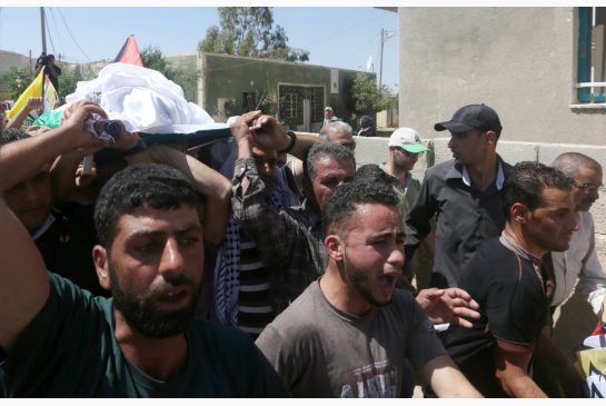 Palestinian men carry the body of Saed Dawabsheh the father of a Palestinian toddler killed last week during an arson attack during his funeral