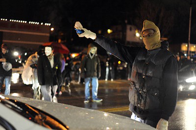 FERGUSON At least one demonstrator was injured as several shots were fired during clashes in the US city of Ferguson late Sunday