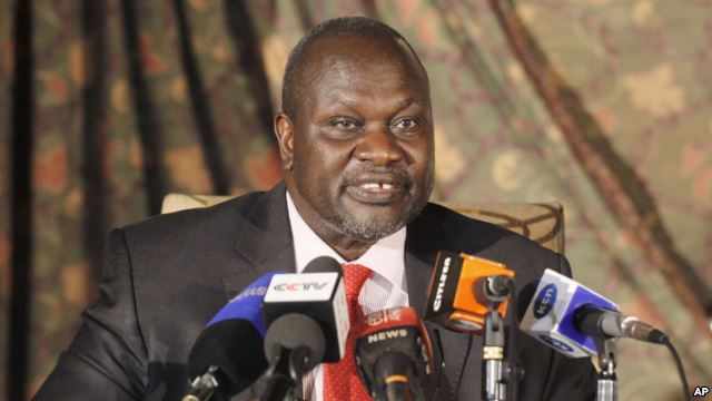 FILE- South Sudan rebel leader Riek Machar addresses journalists during a news conference in Nairobi Kenya