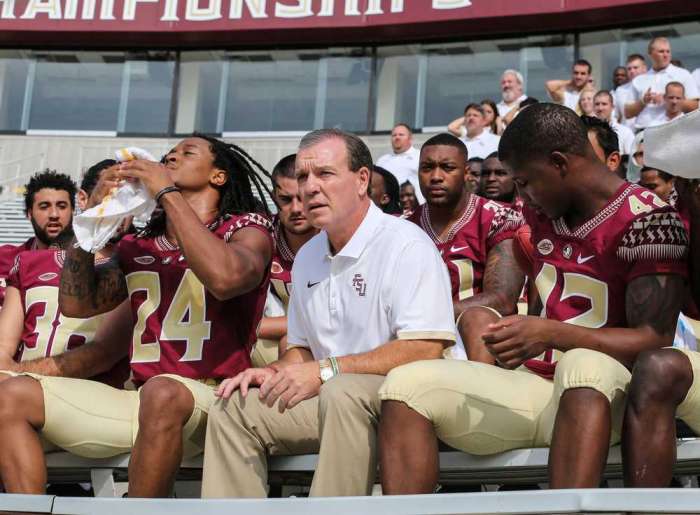 Florida State takes one team photo with player facing battery charge, one without