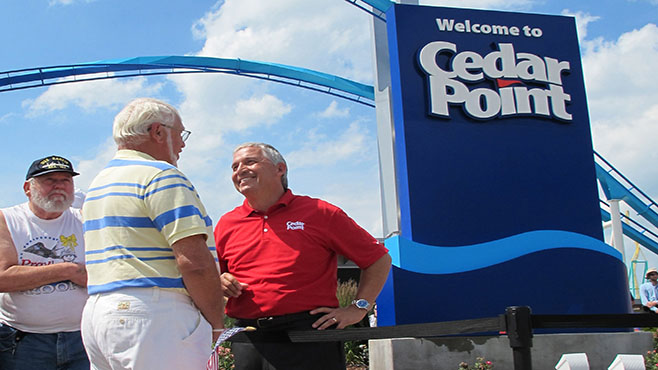 Matt Ouimet chief executive of Cedar Fair Entertainment Co. greets a guest at Cedar Point amusement park in Sandusky Ohio. A man who entered a restricted area at the amusement park to look for a lost cellphone