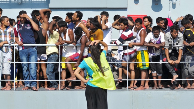 Migrants disembark from the Irish Navy vessel Le Niamh in the Sicilian harbour of Palermo Italy on August 6. More than 2,000 migrants and refugees have died so far this year in attempts to reach Europe by boat