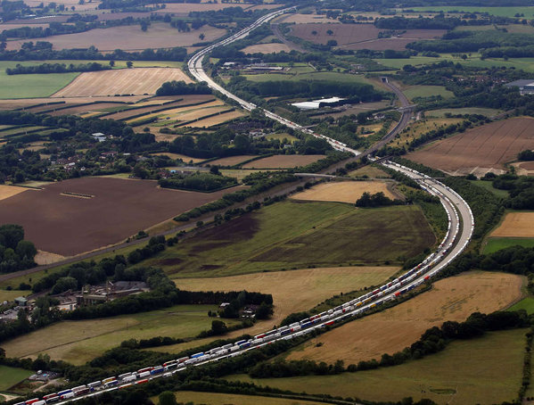 An aerial view of trucks parked in southern England as part of Operation Stack a procedure used by authorities aiming to limit the flow of traffic to the Chunnel. Hundreds of migrants have been trying to rush the rail tunnel into England