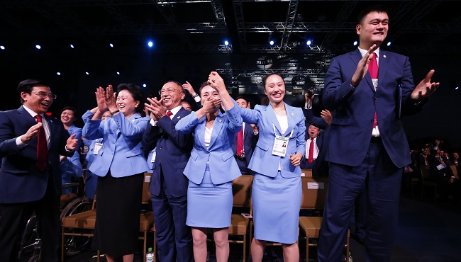 Members of the Beijing 2022 Winter Olympics delegation react after the city was elected to host the 2022 Olympic Winter Games at the IOC meeting in Kuala Lumpur Malaysia Friday