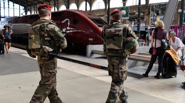 French soldiers patrol the Gare du Nord station in Paris