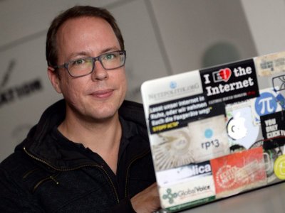 The founder of German news blog Netzpolitik org, Markus Beckedahl right and one of the blog's authors Andre Meister with the German chief prosecutor's treason probe letter in their editorial office in Berlin. The controversial treason