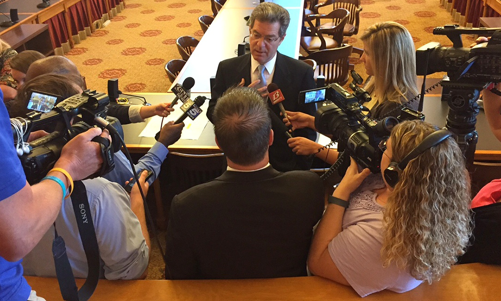 Gov. Brownback talking to reporters after the meeting