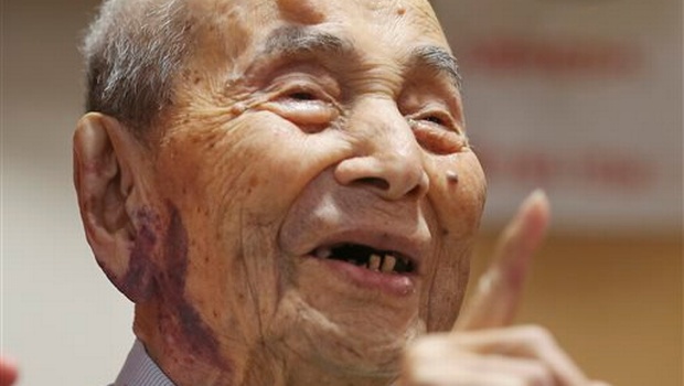 Yasutaro Koide the 112yearold living in the central Japanese city of Nagoya smiles upon being formally recognized as the world's oldest man by the Guinness World Records at a nursing home in Nagoya