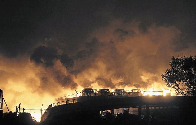 HOT RODS Vehicles burn after two dramatic explosions in the Chinese port of Tianjin on Wednesday night     Image by REUTERS