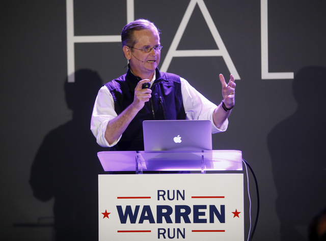 Legal professor Lawrence Lessig accepts the award for lifetime achievement at the 2014 Webby Awards on Monday