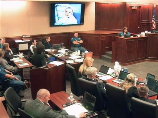 In this image made from Colorado Judicial Department video Arlene Holmes top right the mother of James Holmes fourth from left in white shirt gives testimony during the sentencing phase of the Colorado theater shooting trial in Centennial Colo.