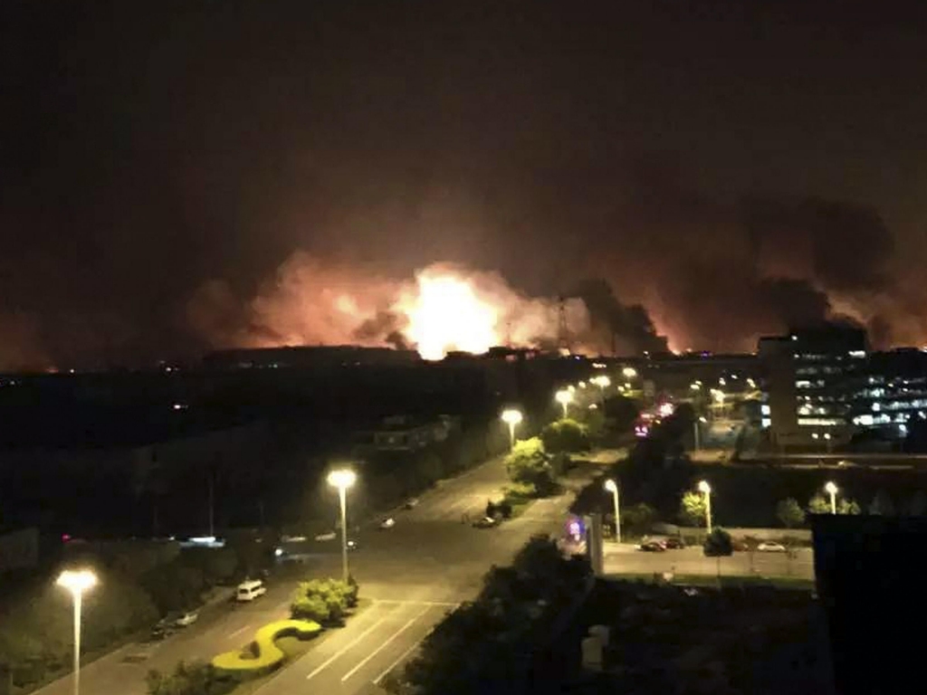 News Agency smoke and fire erupt into the night sky after an explosion in north China's Tianjin Municipality early Thursday Aug. 13 local time