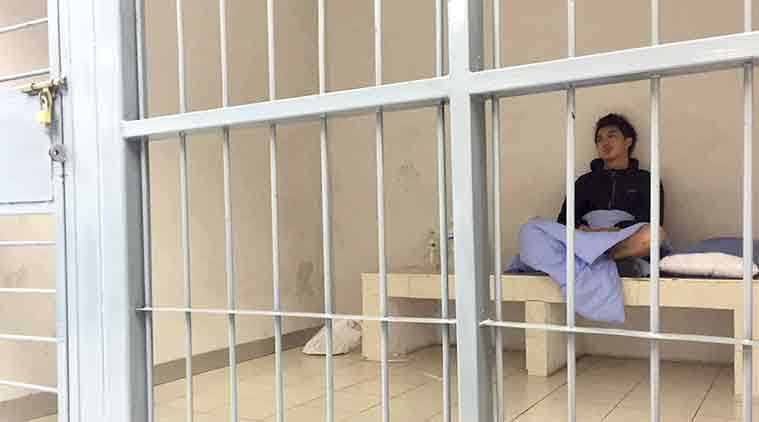 In his image provided by Initium Media Technology Hong Kong journalist Hok Chun Anthony Kwan sits in a cell Monday