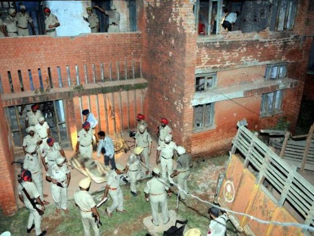 Police officials at the site of the attack in Dhinanagar town of Gurdaspur district in Punjab