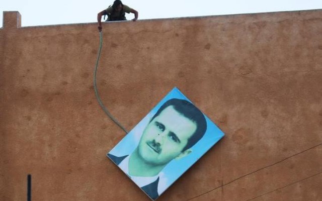 Bashar al Assad in the northwestern city of Ariha after a coalition of insurgent groups seized the area in Idlib province