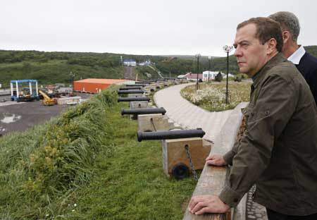 CONTROVERSIAL VISIT Russian Prime Minister Dmitry Medvedev inspects a port station in the Kitovyi village as he visits Iturup one of four islands in the chain that lies off Russia’s far eastern coast and just north of Japan on Medvedev lan