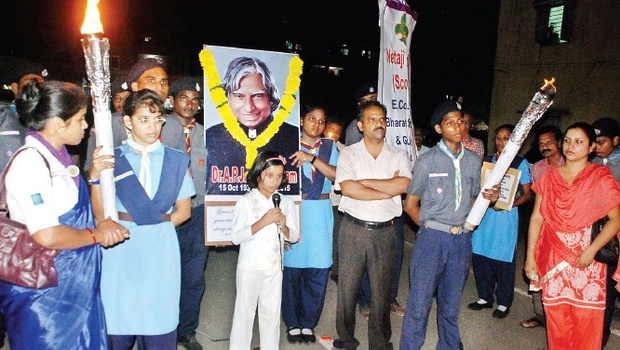 Scouts and Guides of Waltair Division taking out a candle march as a tribute to former President APJ Abdul Kalam in Visakhapatnam on Tuesday. File