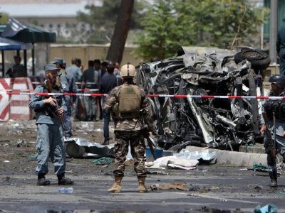 Security forces inspect site of suicide bombing in Kabul