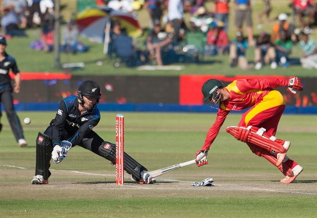 Zimbabwe's batsman Sean Williams scrambles for a run as New Zealand's wicketkeeper Luke Ronchi left attempts a stump during their third and final One Day International Cricket match in Harare Friday Aug. 7 2015