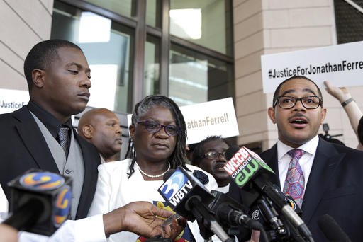 Willie and Georgia Ferrell listen as their attorney Christopher Chestnut talks with reporters about the mistrial in the case of Charlotte policeman Wes Kerrick accused of killing their brother and son Jonathan