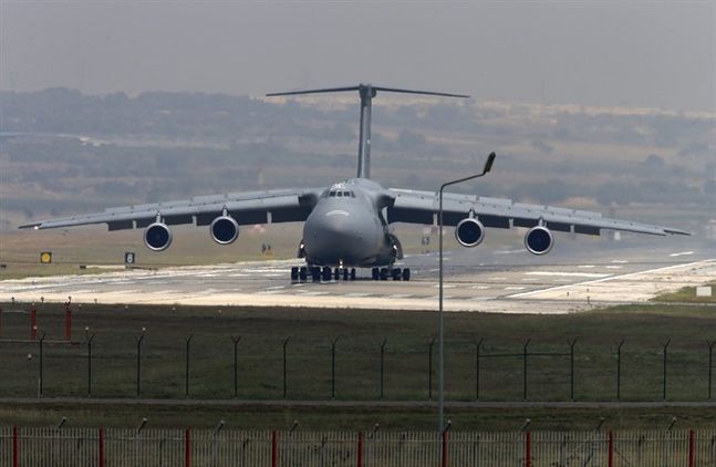 A United States Air Force cargo plane maneuvers on the runway after it landed at the Incirlik Air Base in the outskirts of the city of Adana southeastern Turkey Wednesday