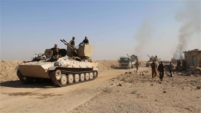 Iraqi Kurdish Peshmerga fighters are seen in an area between the towns of Daquq and Tuz Khurmatu where battles have been raging against Daesh militants