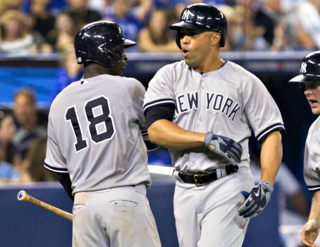 Carlos Beltran is greeted by Didi Gregorius after belting the go-ahead three-run homer in the eighth inning against Jays reliever Aaron Sanchez