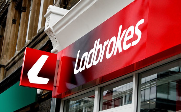 Ladbrokes cuts dividend as first half profits fall