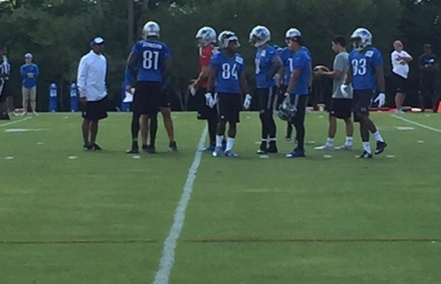 Lions receivers Calvin Johnson and Ryan Broyles among a group of players on the field during Training Camp practice