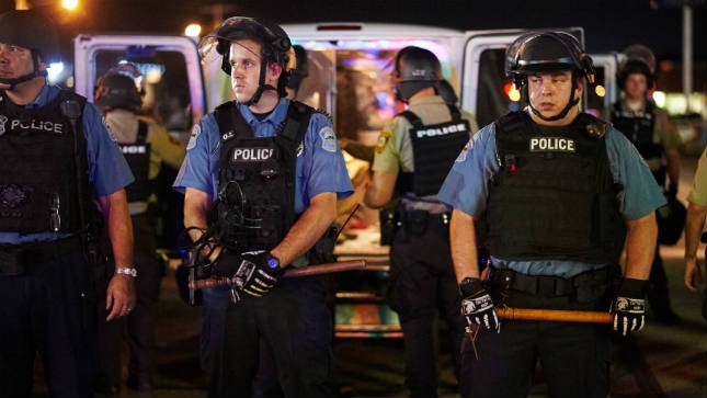 The St Louis police chief says nine people have been arrested and officers have used tear gas to clear a street amid protests after an armed 18yearold was fatally shot by police