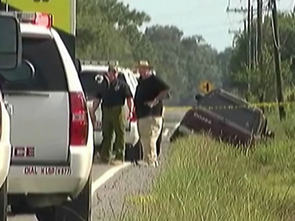 Louisiana State Police check out the scene of a crime Aug. 23 3015 where a trooper was shot in the head when he tried to arrest a driver suspected of being drunk or drugged in southwest Louisiana