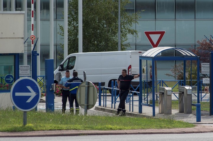 Gendarmes watch as a van transporting the plane debris arrives at the military-run Direction generale de l'armement offices laboratory in Balma near Toulouse. REUTERS  Stringer