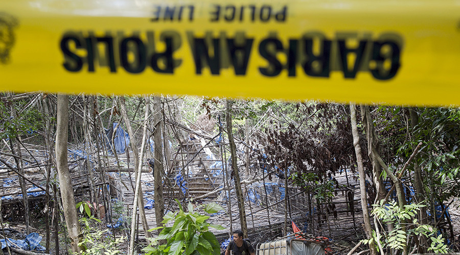 Bodies of 24 suspected human trafficking victims dug up near Malaysia-Thailand