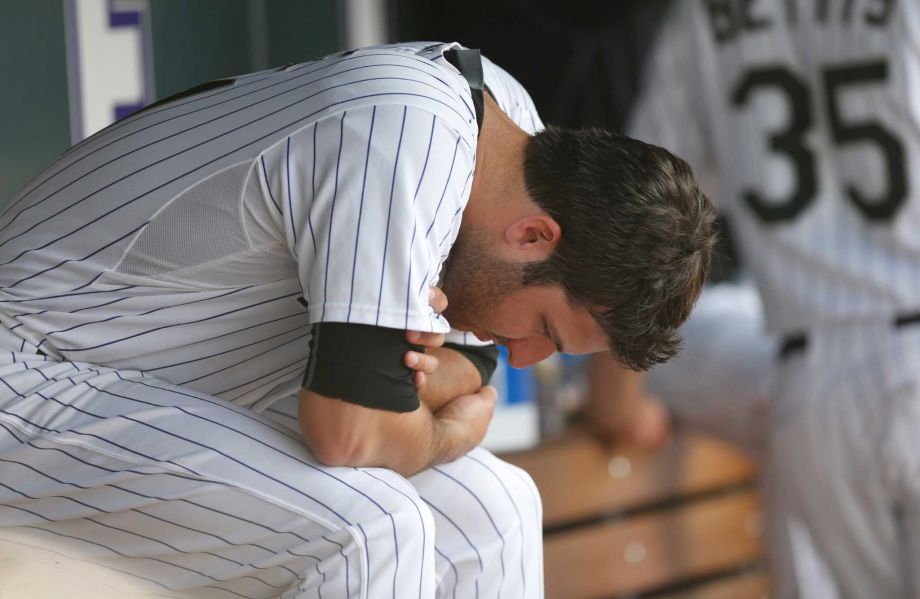 Colorado Rockies starting pitcher David Hale sits in the dugout after retiring the New York Mets in the sixth inning of a baseball game Sunday Aug. 23 2015 in Denver. The Mets won 5-1