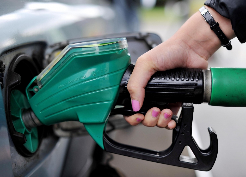 A view of a motorist using an Asda petrol pump