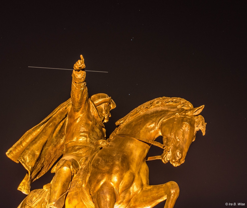 Station flying in front of Big Dipper as visible over the General Sam Houston statue in Hermann Park on Saturday night