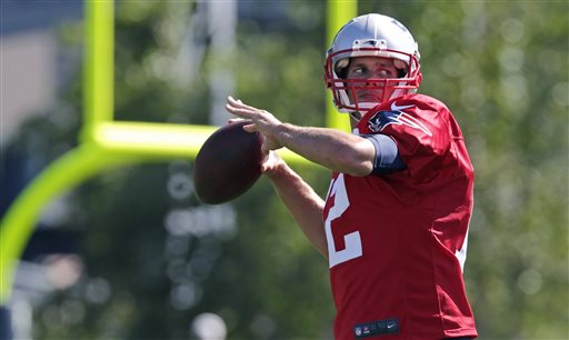 New England Patriots quarterback Tom Brady throws during an NFL football training camp in Foxborough Mass. Friday