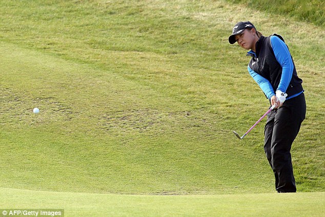 New Zealand's Lydia Ko chips on her way to an opening round of 66 at the Women's British Open