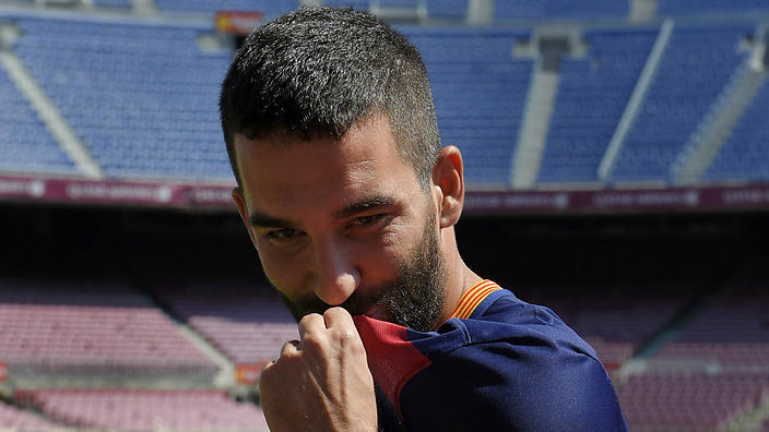 New signing Arda Turan is not eligible to play for Barcelona until January due to the La Liga champion's transfer ban