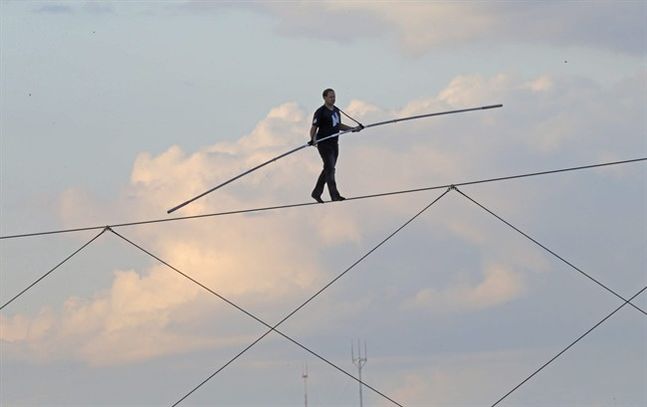 High-wire daredevil Nik Wallenda walks a tightrope above the Milwaukee Mile Speedway at the Wisconsin State Fair in West Allis Wis. Tuesday Aug. 11 2015. Wallenda completed his longest tightrope walk ever during the appearance at the Wisconsin State Fa