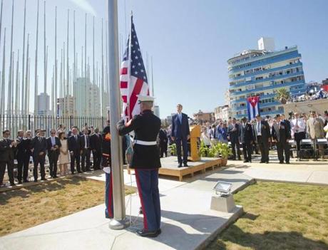 Secretary of State John Kerry stood with other dignitaries as members of the Marines raised the US flag over the newly reopened embassy in Havana Cuba on Friday