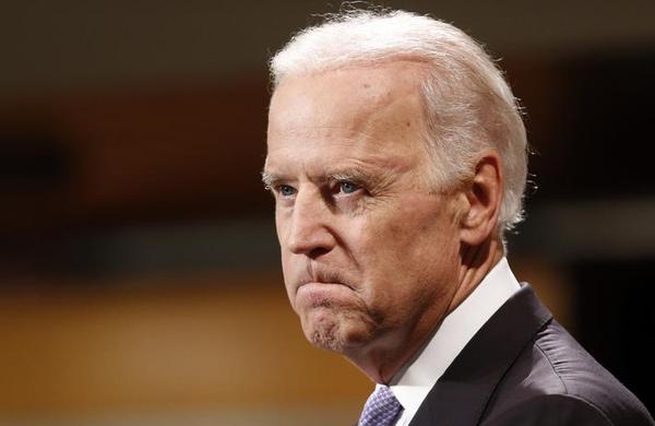 Vice President Joe Biden bites his lip while speaking to students faculty and staff at Harvard University's Kennedy School of Government in Cambridge Mass. Thursday Oct. 2 2014. AP