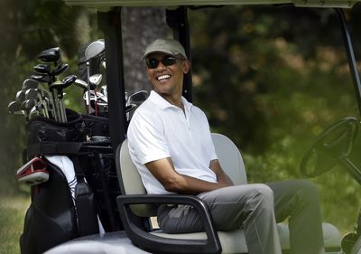 Obama golfs reads and enjoys private beach on vacation