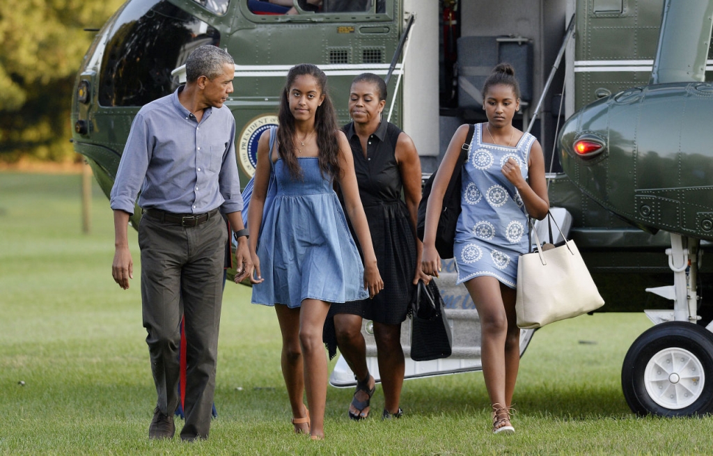 U.S. President Barack Obama daughters Sasha and Malia and First Lady Michelle Obama arrive at the White House